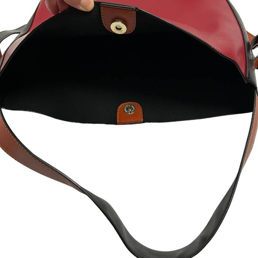 Red black and tan hobo shoulder bag inside black