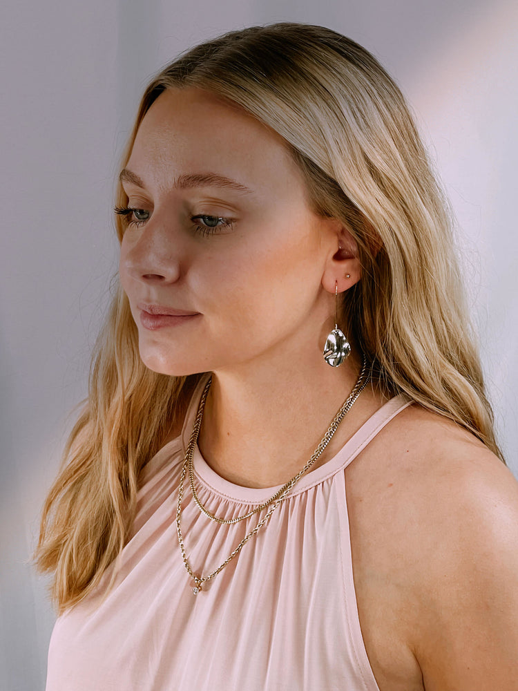 Chic gold tone alloy drop earrings with asymmetrical flakes and a slender bar with fishhook backs
