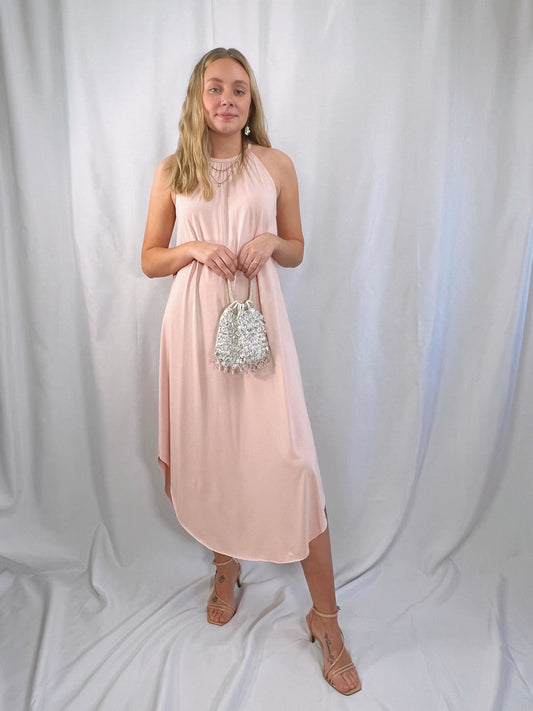 pastel pink pull over halter dress with keyhole back and a soft, swing fit trapeze style