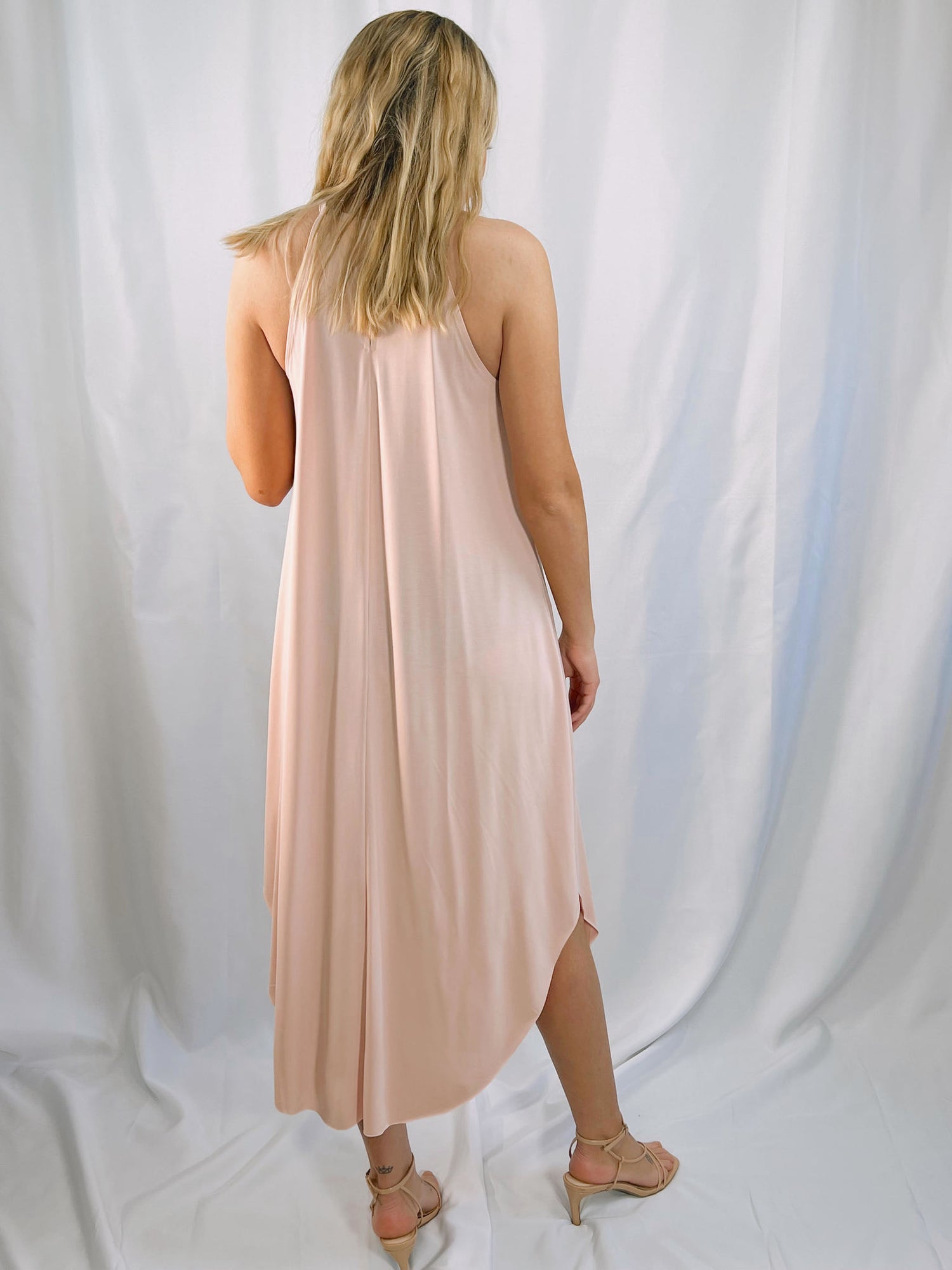 pastel pink pull over halter dress with keyhole back and a soft, swing fit trapeze style