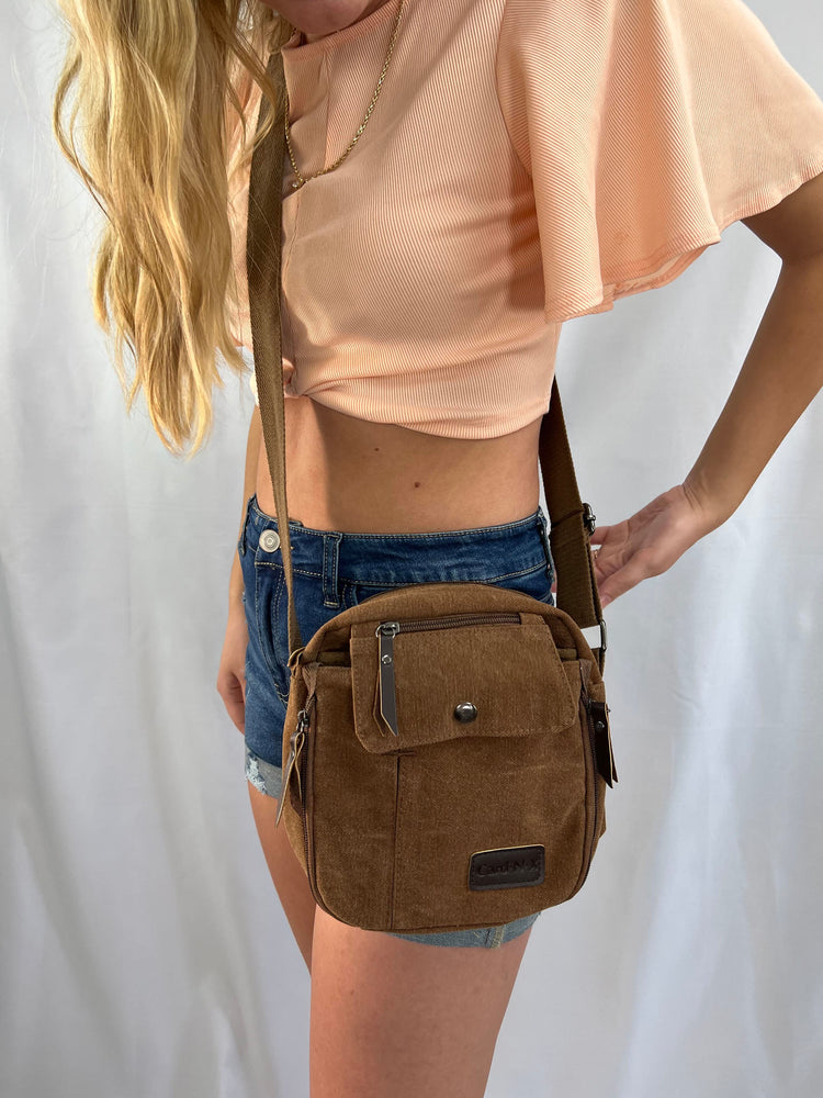 Light peach short draped sleeve crop top with twist front and round neck