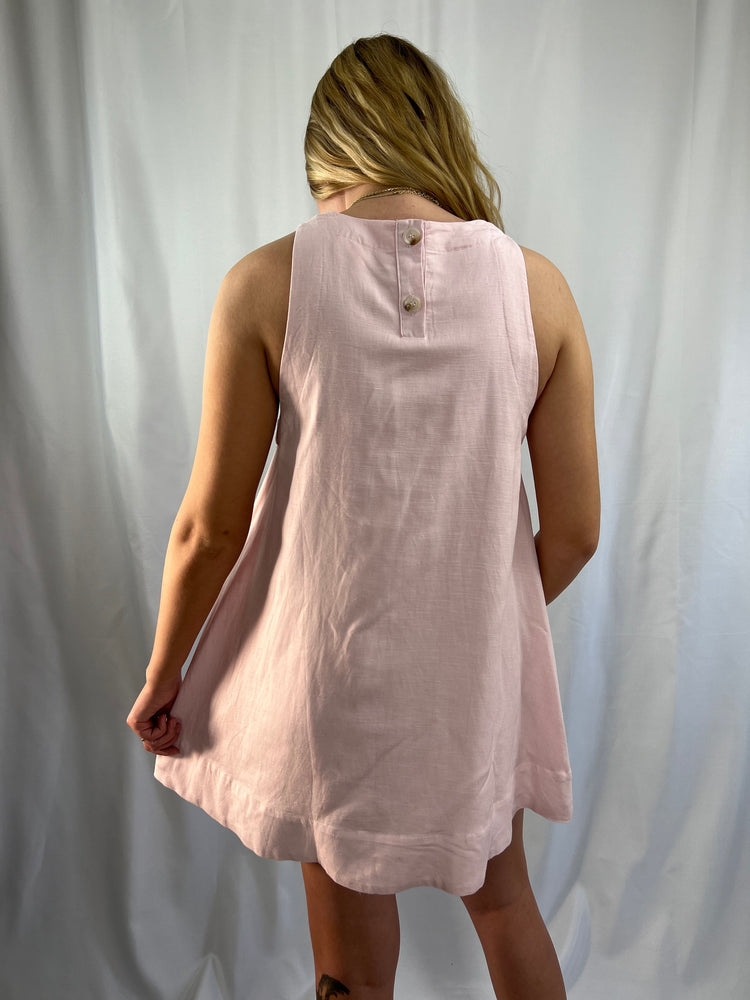 pale pink linen-blend trapeze A-line mini dress fully lined with back neckline button closure 55% Linen 45% Rayon Lining 100% Rayon