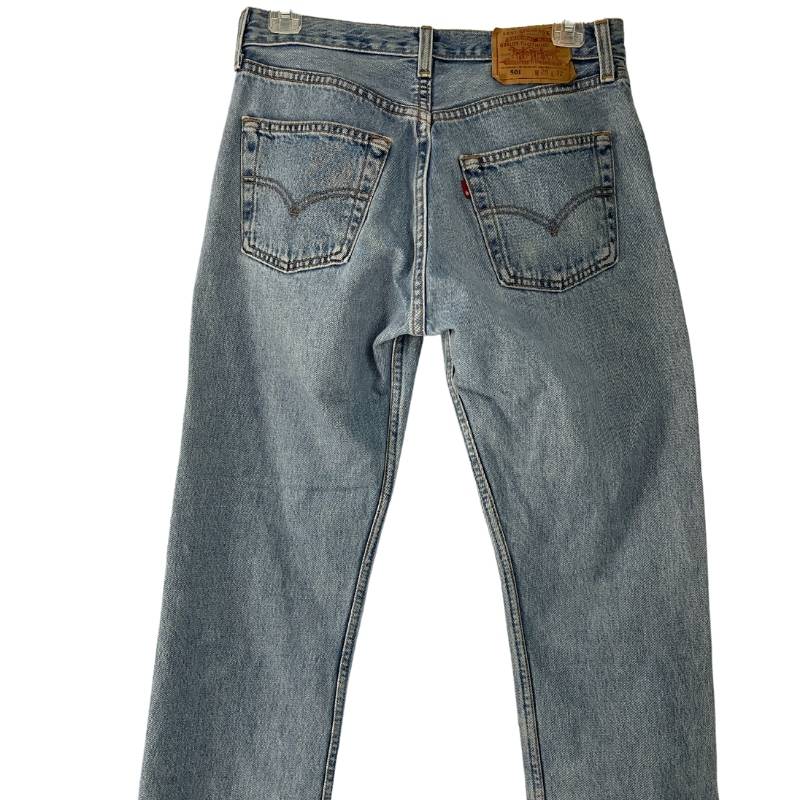 Levi's 501 vintage straight leg, high waist, raw hem, button fly blue jeans.